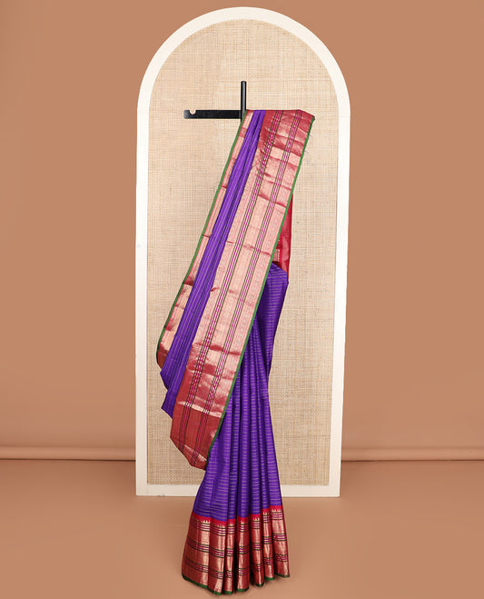 Blue zari stripes silk saree, contrast korvai border of rekku, neli, kamalam, and poo chakram designs, and jaal pallu