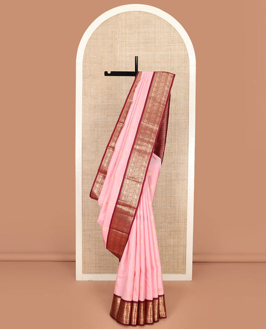 Pink Vasundhara Silk Saree Enriched with Yaanai and Chakram Buttas, Complemented by a Contrast Border of Thazampoo Rekku, Banaras, Mayil, and Yaanai Designs, Grandly Woven Pallu of Jaal Designs, and a Contrast Blouse