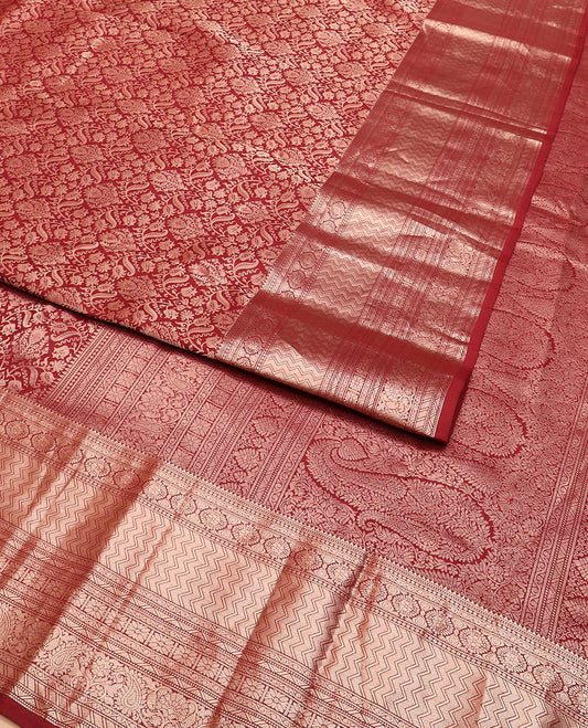 Maroon jacquard Kanchipuram wedding silk saree, zari border of rekku, muthu, chakram, vanki, rekku, floral and paisley designs, and pallu of intricate paisleys