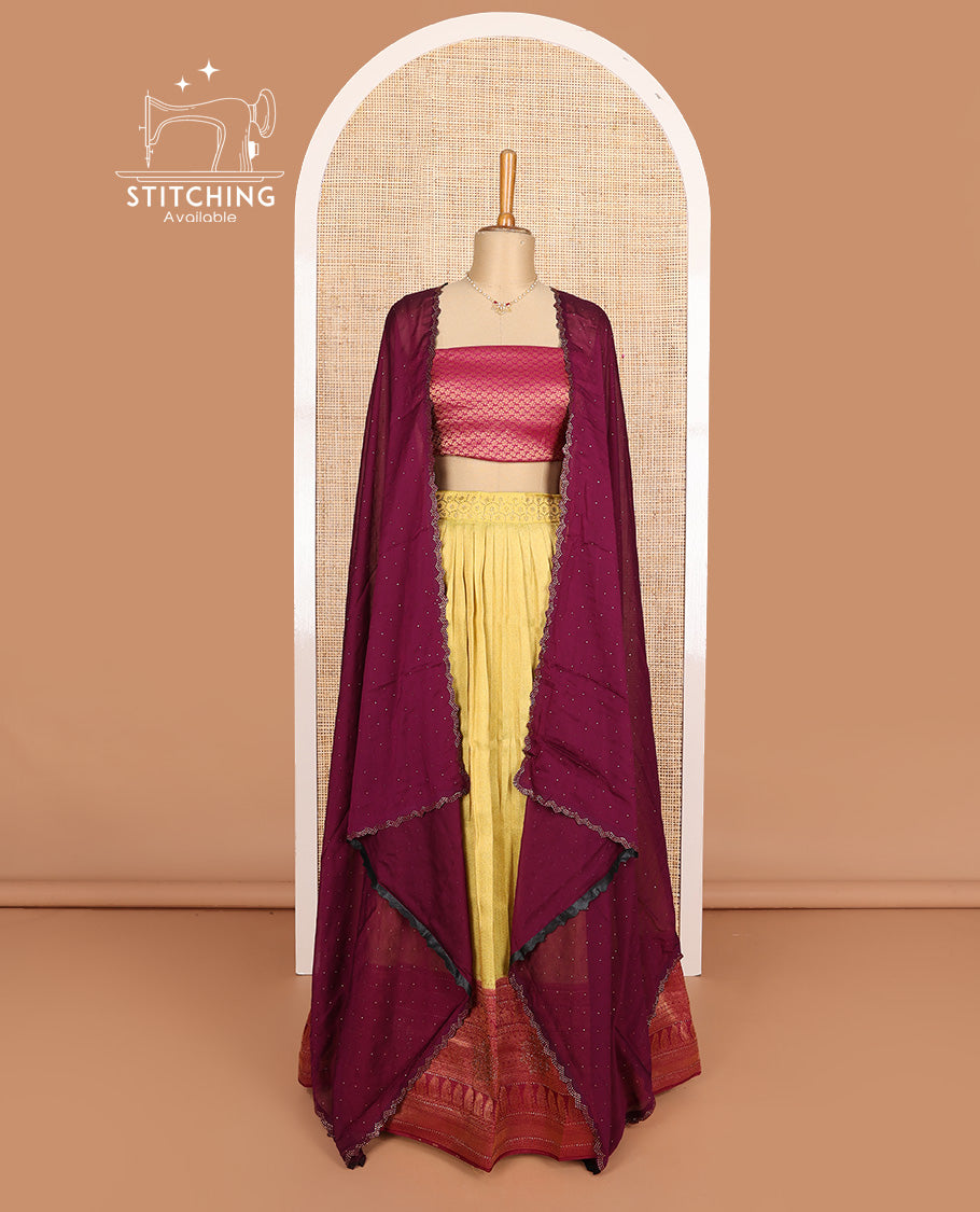 Yellow art silk half-saree, brocade with contrast traditional border skirt, contrast maroon brocade blouse, scallop stone work dhavani, and detachable belt