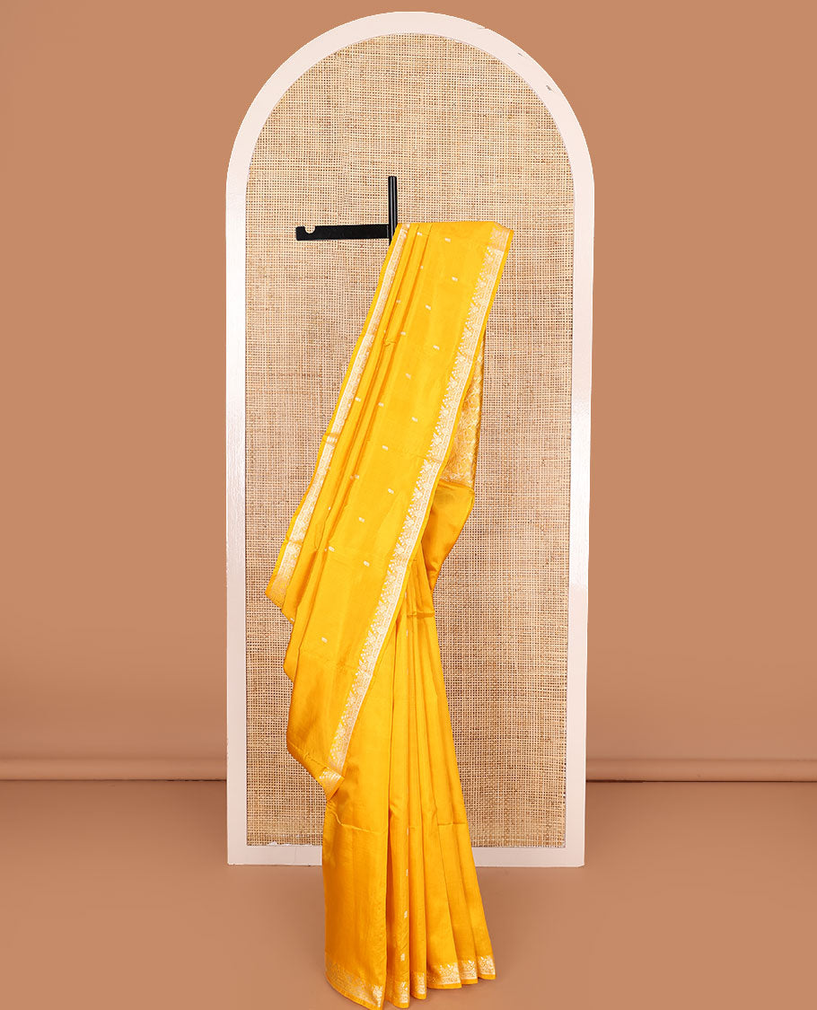 Yellow buttas woven banarasi kathan silk saree, zari border, and floral jaal pallu