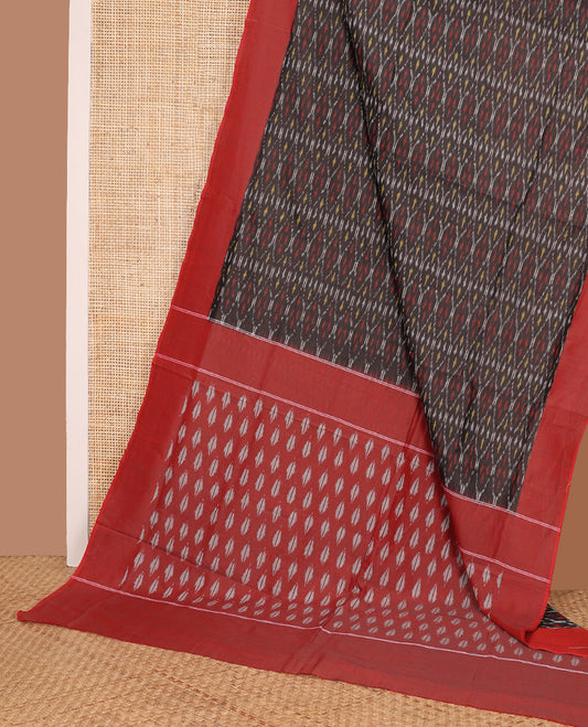 Brown ogee patterned ikkat cotton saree, contrast plain border, and pallu of buttas