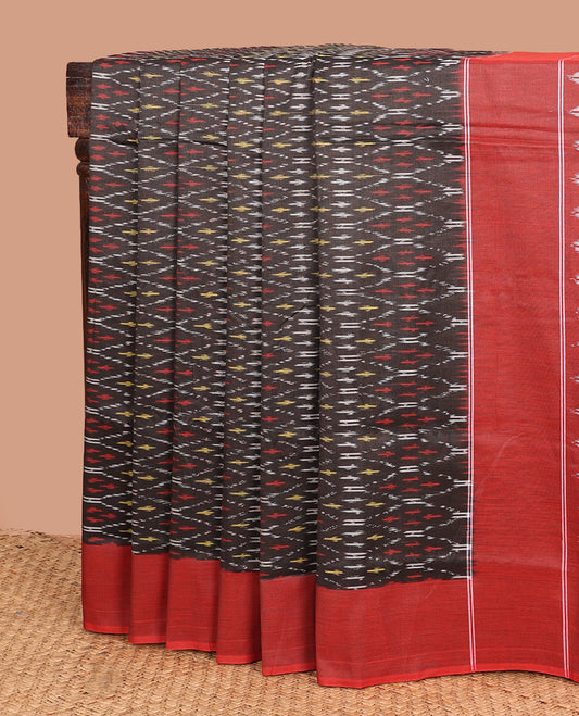 Brown ogee patterned ikkat cotton saree, contrast plain border, and pallu of buttas
