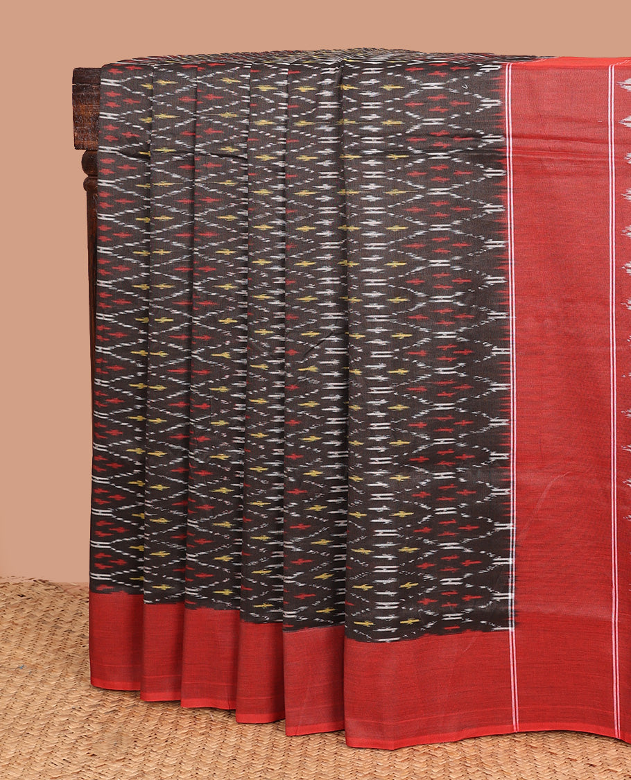 Brown ogee patterned ikkat cotton saree, contrast plain border, and pallu of buttas