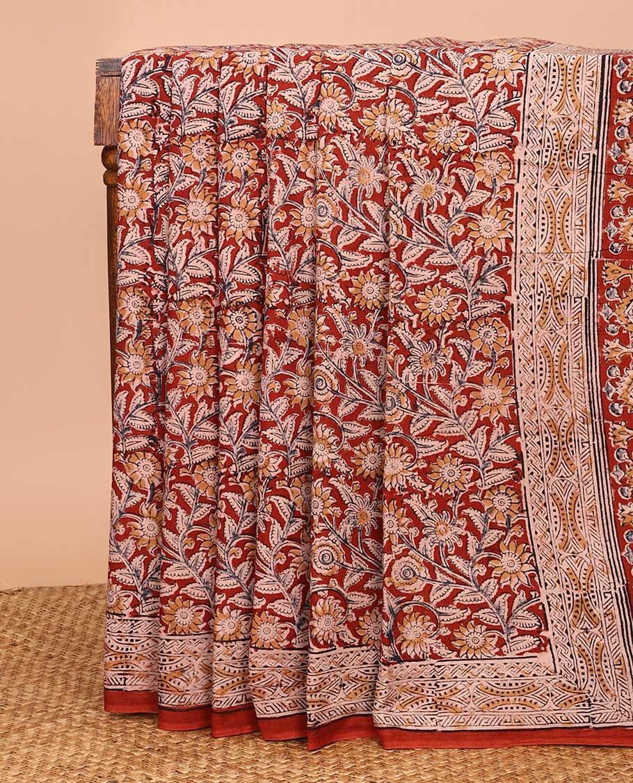 Maroon floral vine machine-printed Kalamkari cotton saree, printed border, and pallu of floral-print