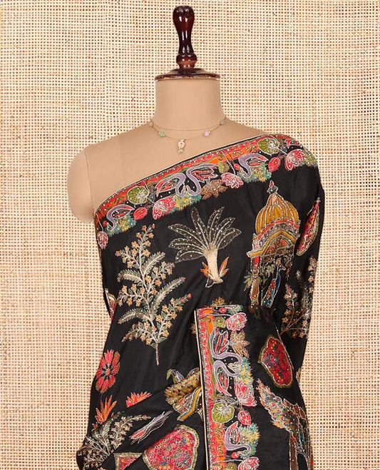 Black Dola Silk Saree, Featuring Colorful Flora, Fauna, and Mughal-Style Print on Its Body, Highlighted by Kaleidoscopic-Colored Floral-Bird Embroidered Border, Pallu Mirroring the Same Design, and Paired with a Contrast Blouse