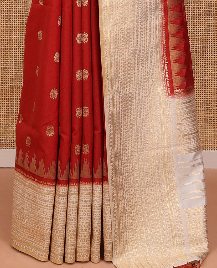 Rust Dupion Silk Saree, Decked Up with Zari Buttas All Over Its Body, Complemented by a Contrast Temple Traditional Zari Design Woven Border, Traditional Pallu of Temple Designs, and Paired with a Contrast Blouse