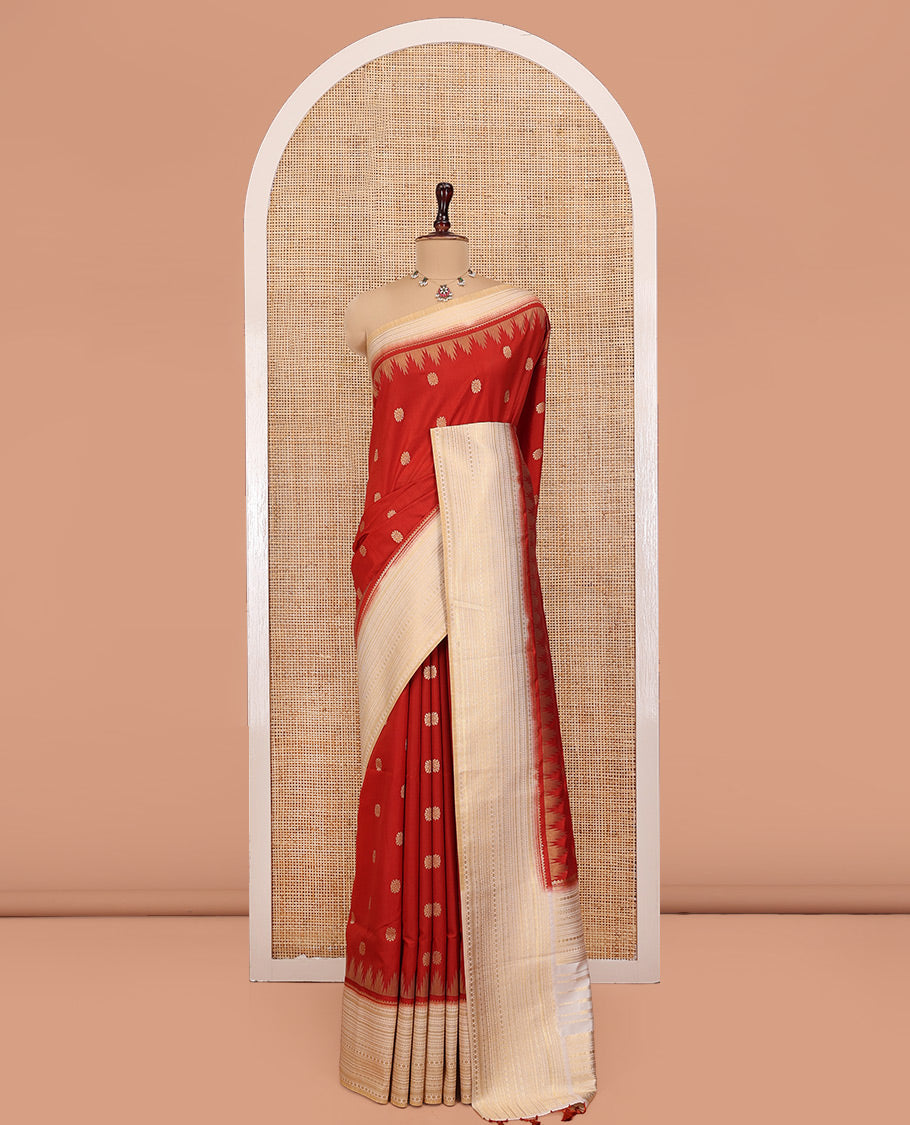 Rust Dupion Silk Saree, Decked Up with Zari Buttas All Over Its Body, Complemented by a Contrast Temple Traditional Zari Design Woven Border, Traditional Pallu of Temple Designs, and Paired with a Contrast Blouse