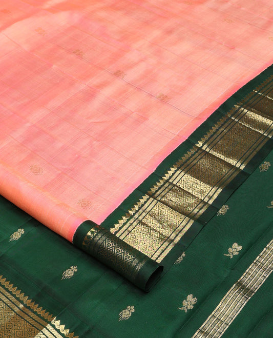 Pink zari buttas Kanchipuram silk saree, contrast one-sided korvai border of salangai, banaras, and jaal designs, and zari design pallu