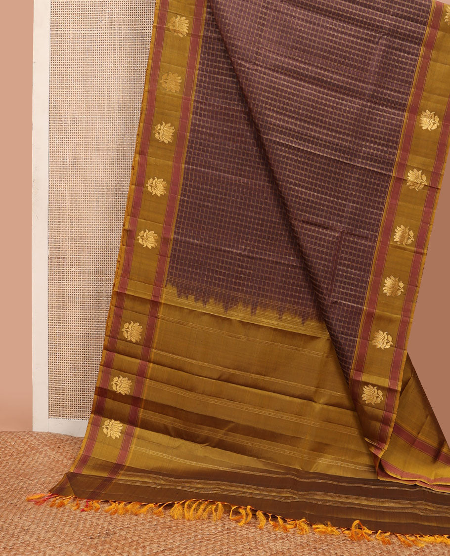 Brown checked Kanchipuram silksaree, contrast lotus design border & pallu of zari stripes