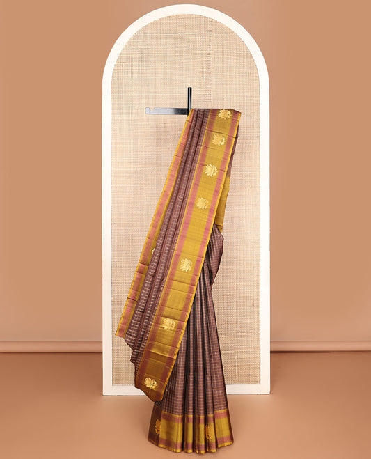 Brown checked Kanchipuram silksaree, contrast lotus design border & pallu of zari stripes