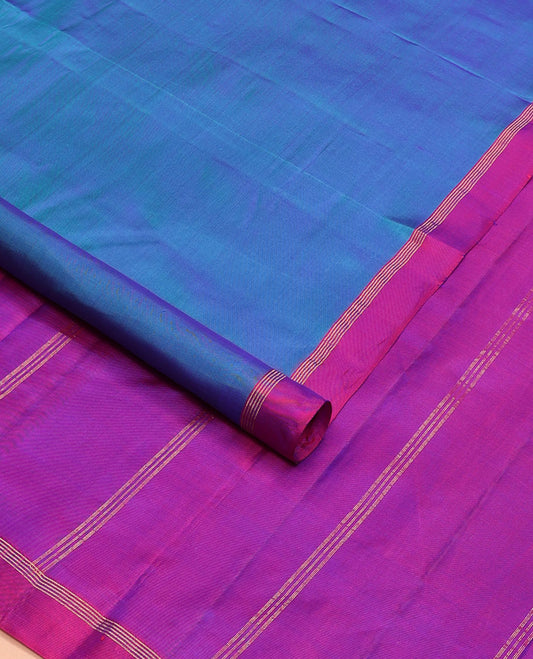 Blue plain design Kanchipuram silk saree, contrast zari striped border & zari striped pallu