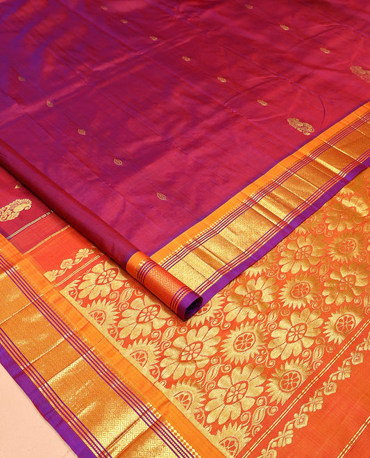 Maroon Kanchipuram Silk Saree, Mesmerized with Zari Buttas All Over Its Body, Complemented by a Contrast One-Sided Border of Panner Sombu, Banaras, Muthu, and Mayil Kann Designs, Pallu of Floral Designs, and Comes Without a Blouse