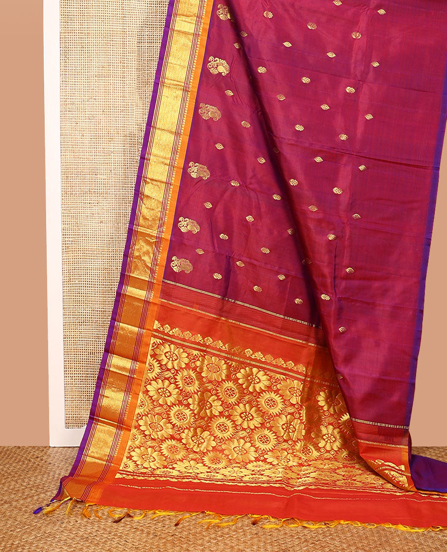 Maroon Kanchipuram Silk Saree, Mesmerized with Zari Buttas All Over Its Body, Complemented by a Contrast One-Sided Border of Panner Sombu, Banaras, Muthu, and Mayil Kann Designs, Pallu of Floral Designs, and Comes Without a Blouse