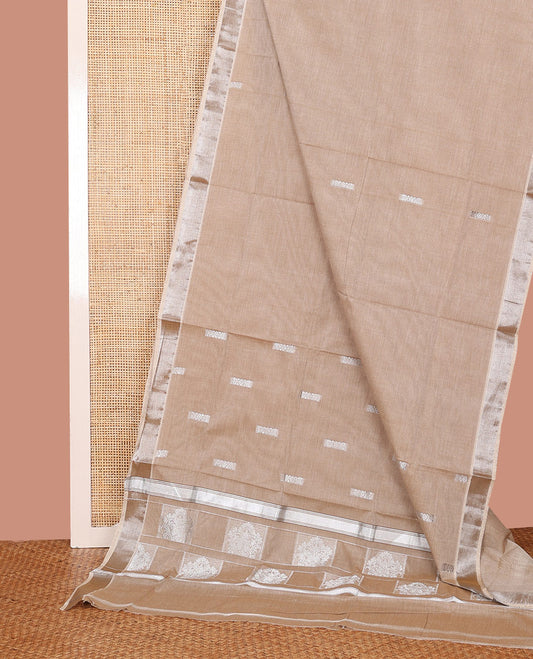 Pale Brown Kerala Saree, Lightly Embellished with Zari Buttas on Its Body, Subtly Sparkled Bavanji Border, Pallu Depicting Intricate Designs, and Paired with a Matching Blouse