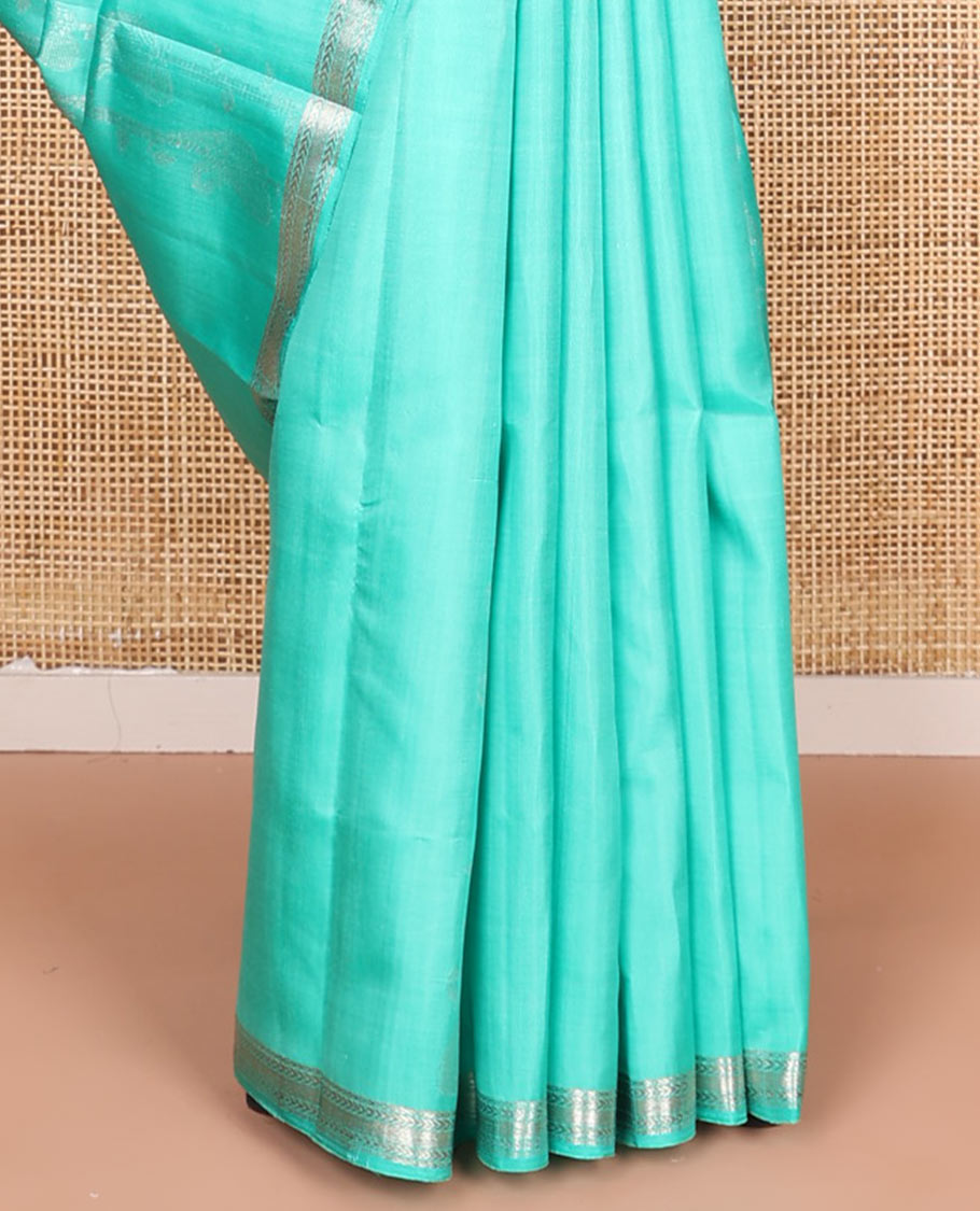 Turquoise zari design soft silk saree, zari border of kathir designs, and zari-rich pallu