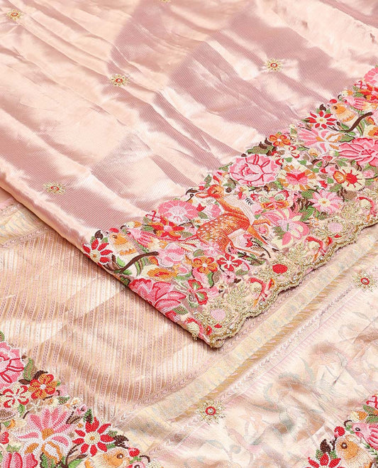 Pink jacquard with embroidered tissue silk saree, colorful jungle-theme flora-fauna mixed embroidered scallop border, and geometric patterned pallu