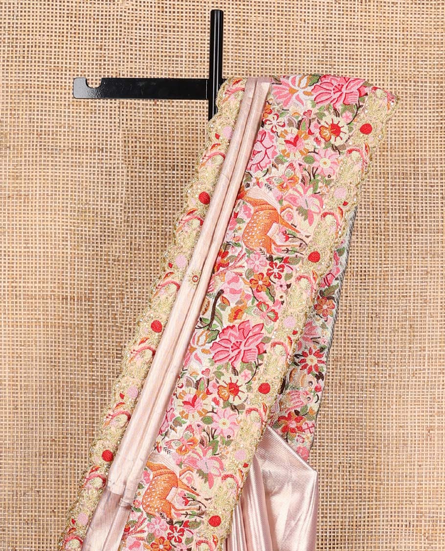 Pink jacquard with embroidered tissue silk saree, colorful jungle-theme flora-fauna mixed embroidered scallop border, and geometric patterned pallu