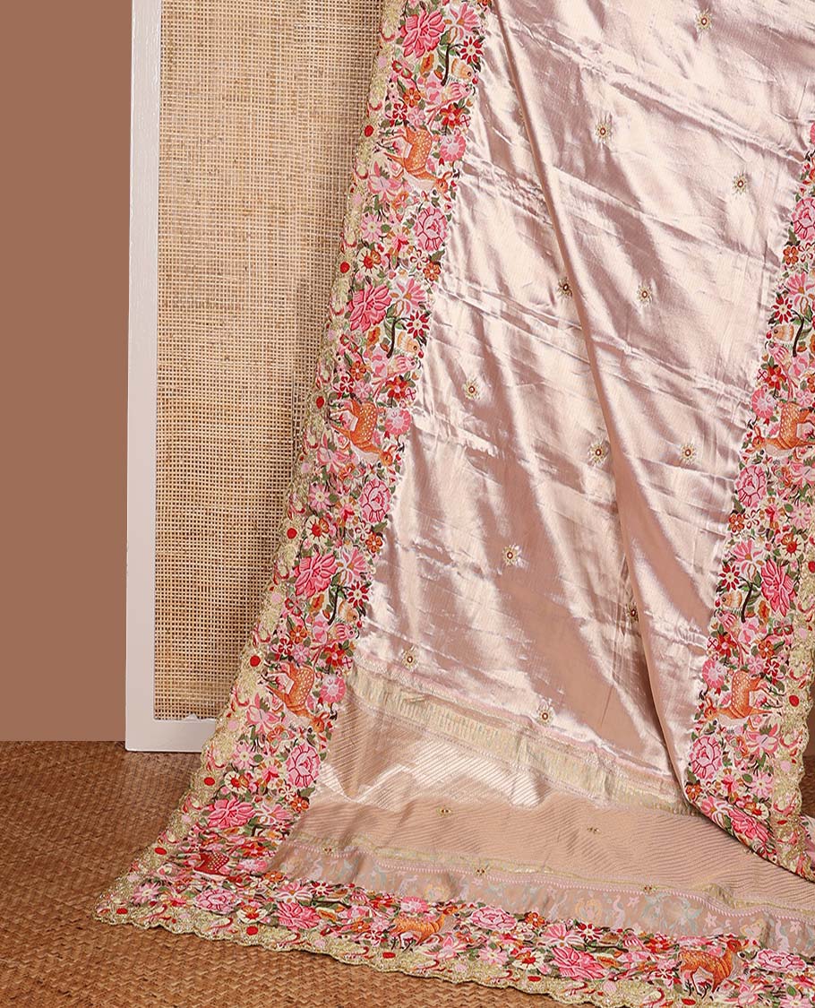 Pink jacquard with embroidered tissue silk saree, colorful jungle-theme flora-fauna mixed embroidered scallop border, and geometric patterned pallu