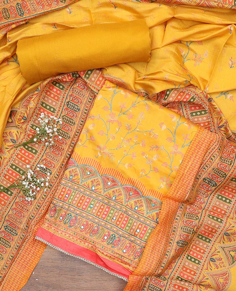 Yellow material churidar set, floral and kaleidoscopic geometric patterned rayon top, plain bottom, and dupatta of floral and geometric patterns