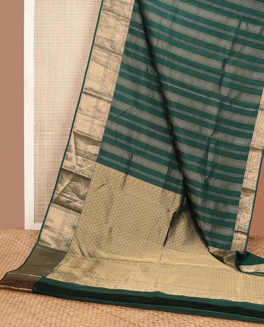 Green zari design silk saree, zari border of thilakam mokku,kodi visiry,mayil & then kuli kann & jaal pallu