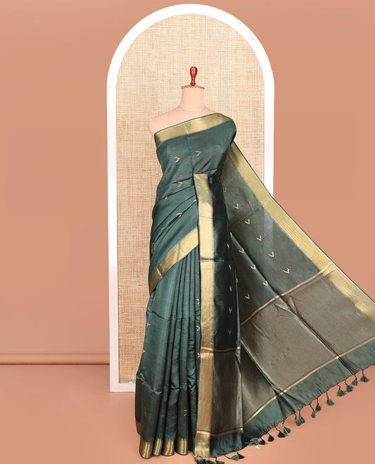 Green Banana Pith Saree Decorated with Zari Temple Buttas, Delicately Woven Temple Zari Border, Gleaming Zari Pallu of Horizontal Stripes in Zari, and Paired with a Matching Plain Blouse