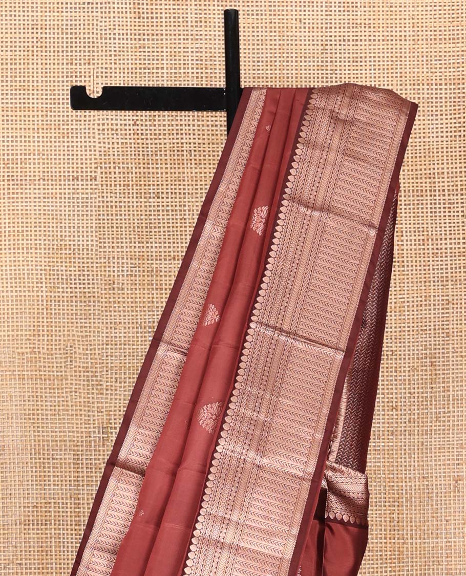 Redwood Colored Vasundhara Silk Saree, Spotlighted with Zari Buttas on Its Body, Complemented by Contrast Border of Thilakam Mokku, Diamond, Rettai Neli, and Kathir Designs, Intricately Designed Pallu, and Paired with a Contrast Blouse