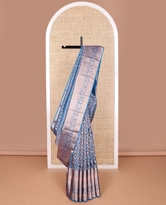 Blue floral jacquard kancheepuram silk saree with self border of thilakam mokku, banaras, poo chakram, manga, kodi visiry design & zari design pallu