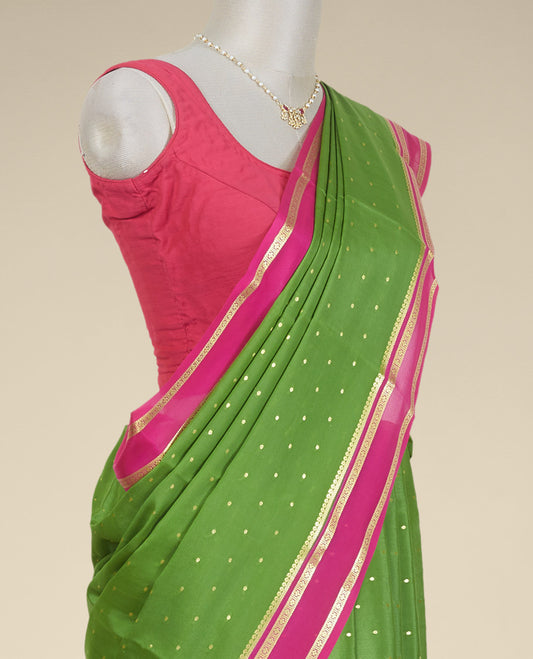 Green buttas mysore silk saree with contrast rettai pettu floral design border