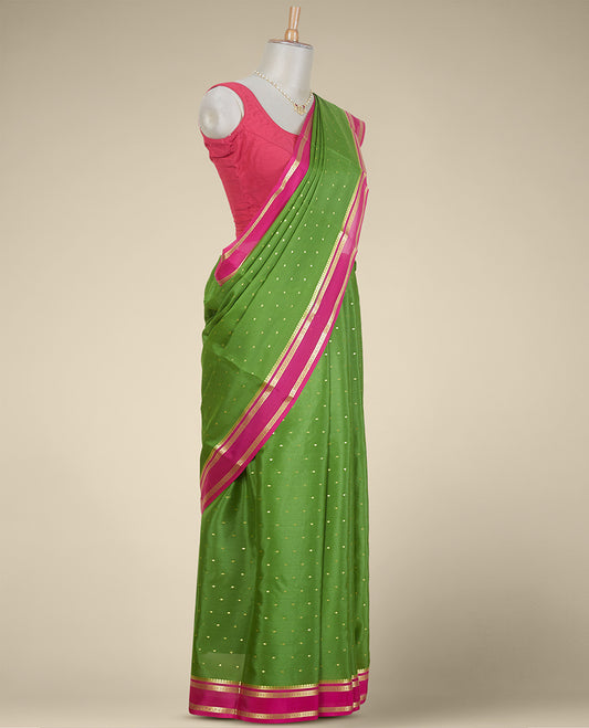 Green buttas mysore silk saree with contrast rettai pettu floral design border