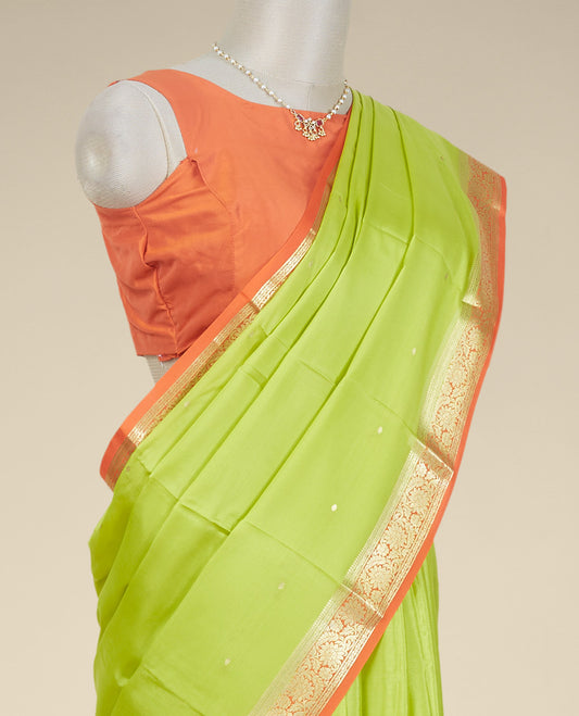 Light green buttas mysore silk saree with contrast floral design border