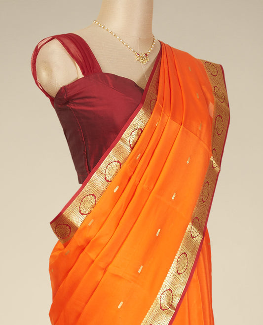 Orange buttas mysore silk saree with contrast floral design border