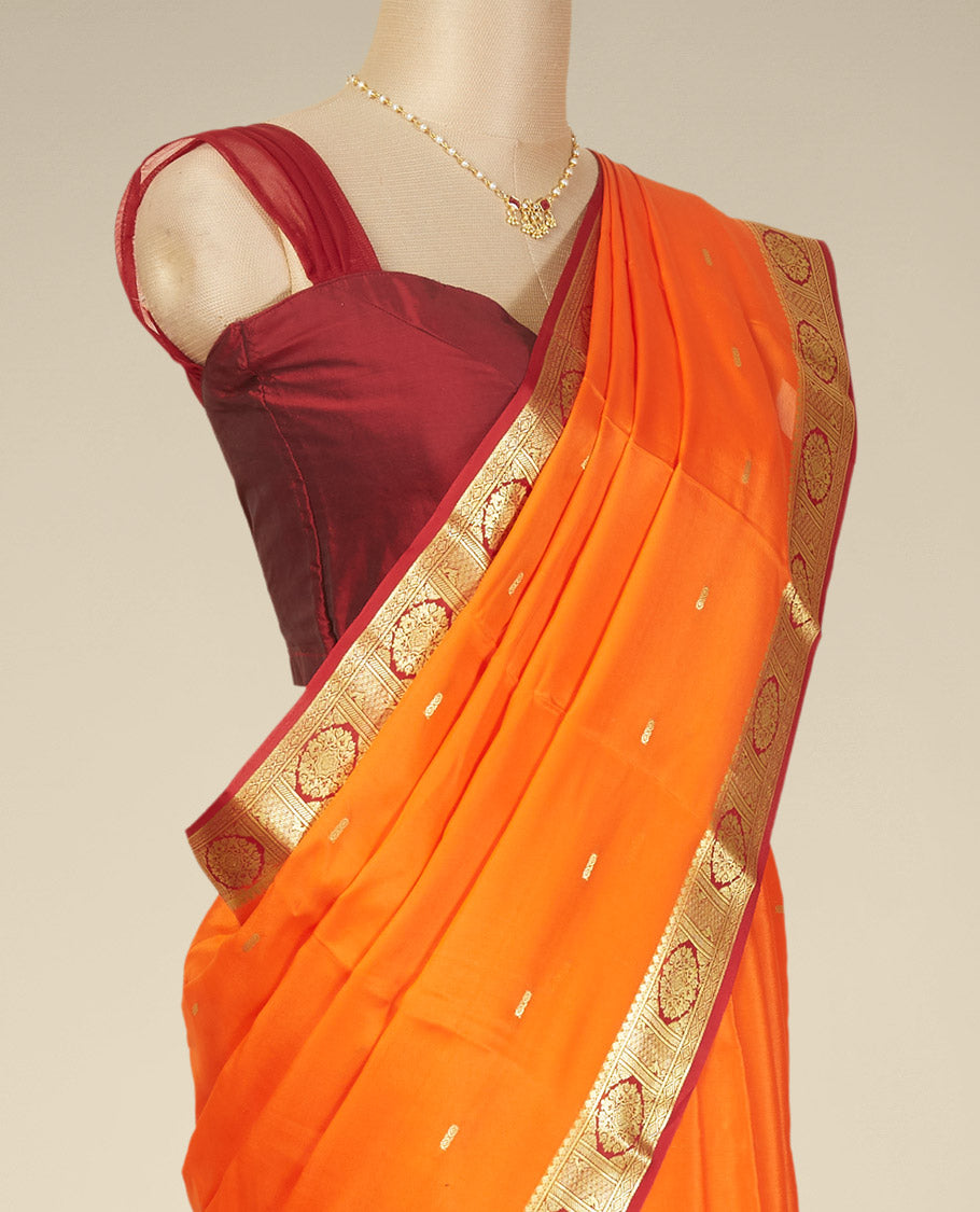 Orange buttas mysore silk saree with contrast floral design border
