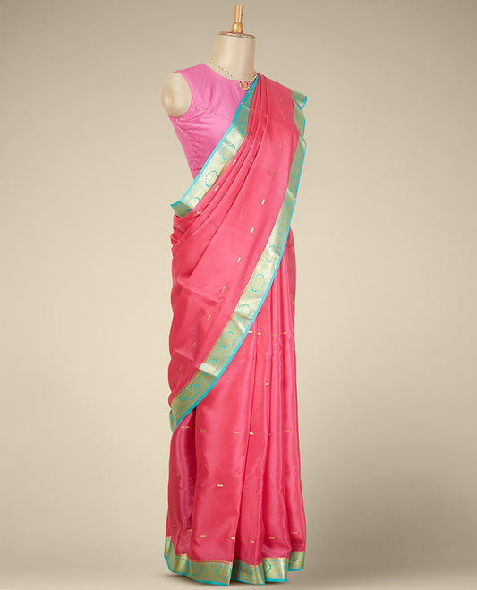 Pink buttas mysore silk saree with contrast floral zari design border