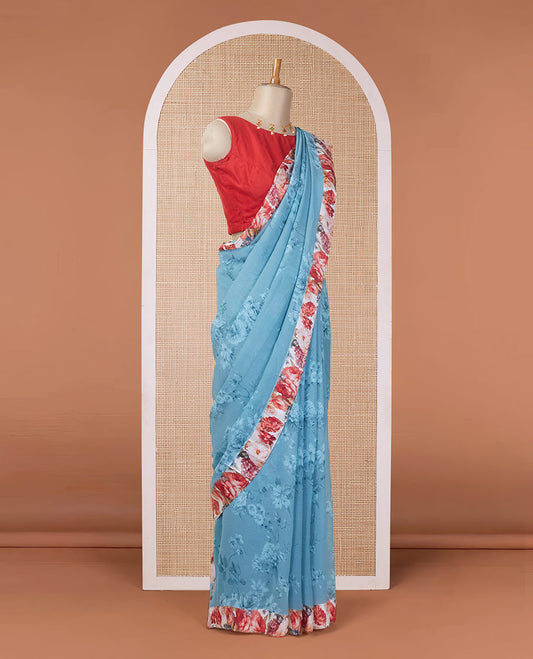Blue floral motifs digitally printed pure chiffon saree with contrast floral printed patch border & zari striped pallu