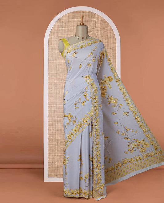 Grey digitally printed pure crepe saree with yellow floral & bird motifs & slanting stripes printed border