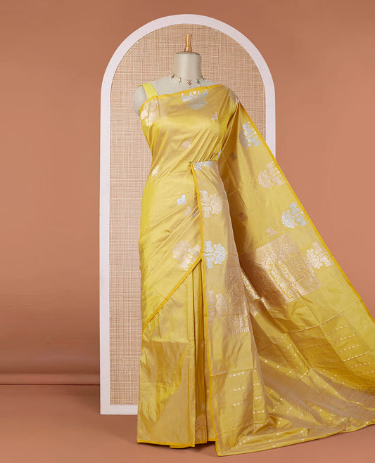 Borderless yellow katan silk saree with pichwai under a tree motifs in zari, pallu of mughal-style & dobble-style motifs