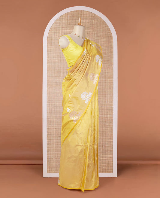 Borderless yellow katan silk saree with pichwai under a tree motifs in zari, pallu of mughal-style & dobble-style motifs