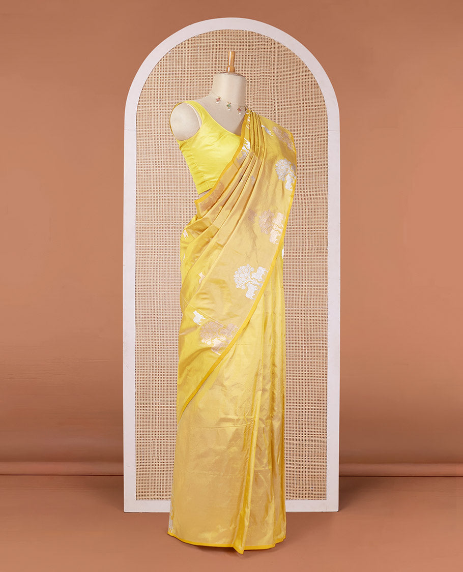 Borderless yellow katan silk saree with pichwai under a tree motifs in zari, pallu of mughal-style & dobble-style motifs
