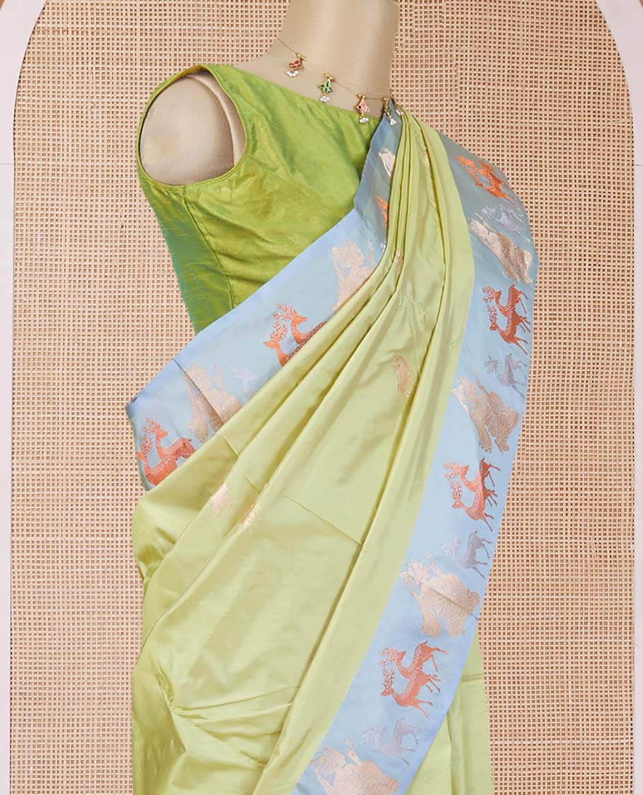 Green katan silk saree with deer motifs, contrast border of deer & human motifs & pallu with deer motif enclosed checks