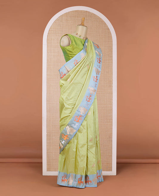 Green katan silk saree with deer motifs, contrast border of deer & human motifs & pallu with deer motif enclosed checks