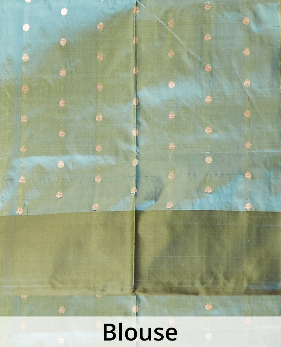 Green dual-shaded katan silk saree with pichwai cow motifs, contrast zari border & pallu features intricate designs
