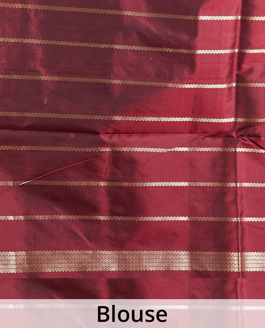 Maroon katan silk saree with patola-style zari buttas, zari border & pallu of patola-style animal motifs enclosed checks