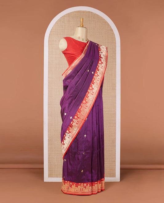 Purple katan silk saree with zari buttas, contrast border & zari-rich pallu adorned with Mughal-theme buildings