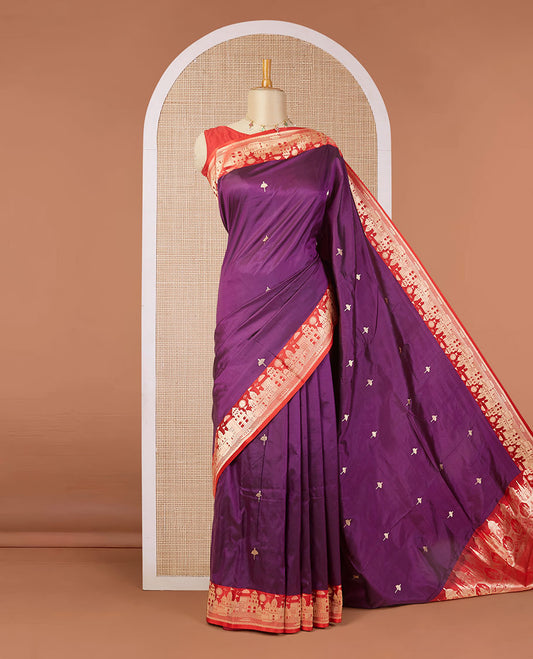 Purple katan silk saree with zari buttas, contrast border & zari-rich pallu adorned with Mughal-theme buildings