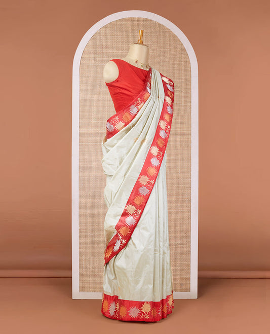 Half-white zari buttas katan silk saree, contrast floral design zari border & geometric patterned pallu