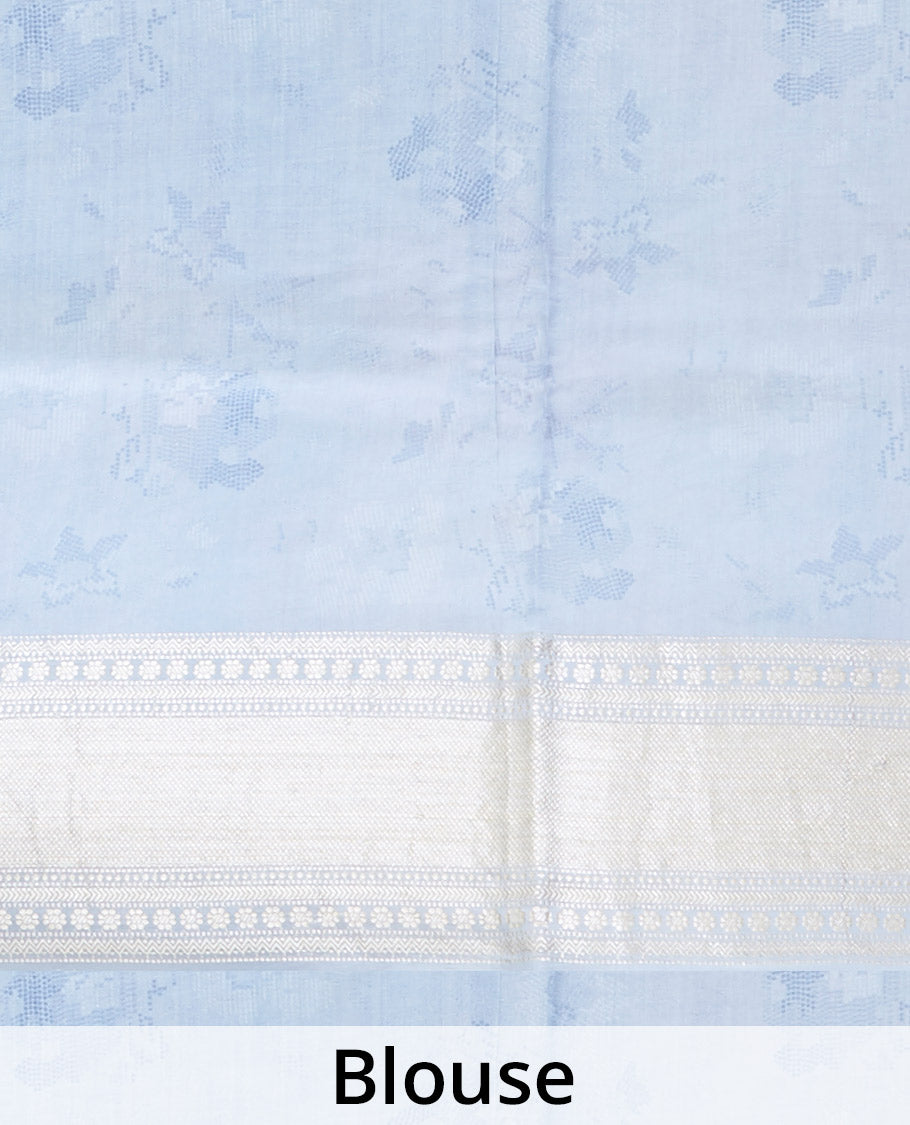 Blue printed chiniya silk saree with colorful floral motifs, traditional zari design border