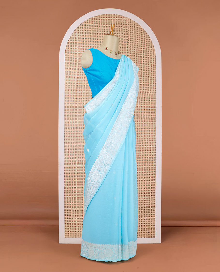 Blue banarasi georgette saree with zari buttas, floral creeper zari border & pallu of floral designs