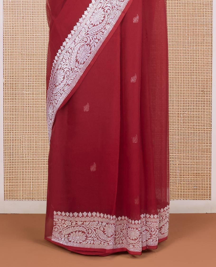 Maroon banarasi georgette saree with zari buttas, floral creeper zari border & pallu of paisleys