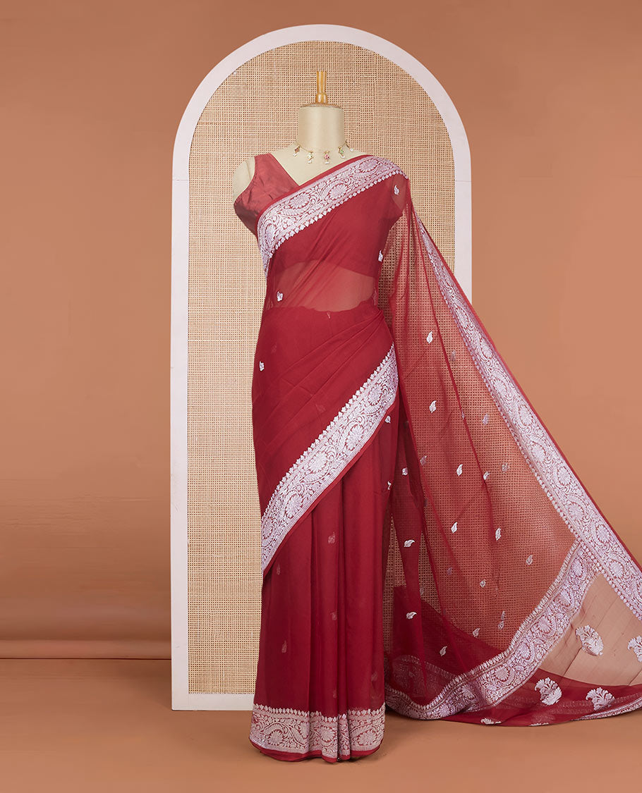 Maroon banarasi georgette saree with zari buttas, floral creeper zari border & pallu of paisleys